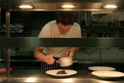 James plating up in the kitchen